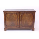 Antique figured mahogany desk with inset leather writing surface,