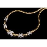 White and yellow gold necklace with pavé set diamond X-shape links,