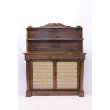 Regency rosewood chiffonier, the shelved superstructure with shaped gallery and roundel ornament,