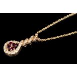 Ruby and diamond gold (18ct) pendant necklace with a cluster of four oval cut rubies,