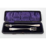 Pair early 20th century silver pickle forks in the form of tridents,