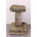 Carved stone bird bath, square-sided on flared square column and square plinth,