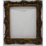 An early 19th century gilt and gesso frame - internal size 77cm x 64cm