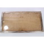 Large Edwardian silver photograph frame of plain rectangular form,