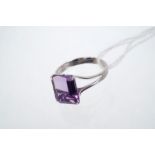 Amethyst single stone ring, the step cut amethyst weighing approximately 5.