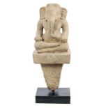 Early Indian carved stone figure of Ganesh, on tapering square column, 45cm high,