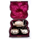 Victorian silver three piece tea set - comprising teapot of compressed baluster half-fluted form,