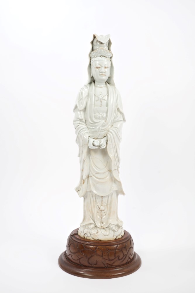 Large 17th century Chinese blanc-de-chine figure of Guanyin holding a scroll,