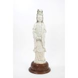 Large 17th century Chinese blanc-de-chine figure of Guanyin holding a scroll,