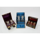 Three 19th century cased perfume bottle sets in fitted cases, with cut and moulded glass bottles.
