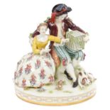 Late 19th century Dresden porcelain figure group of a romantic couple with a bird in cage and