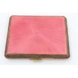 1920s gilt metal and pink enamelled cigarette case with engine-turned decoration,