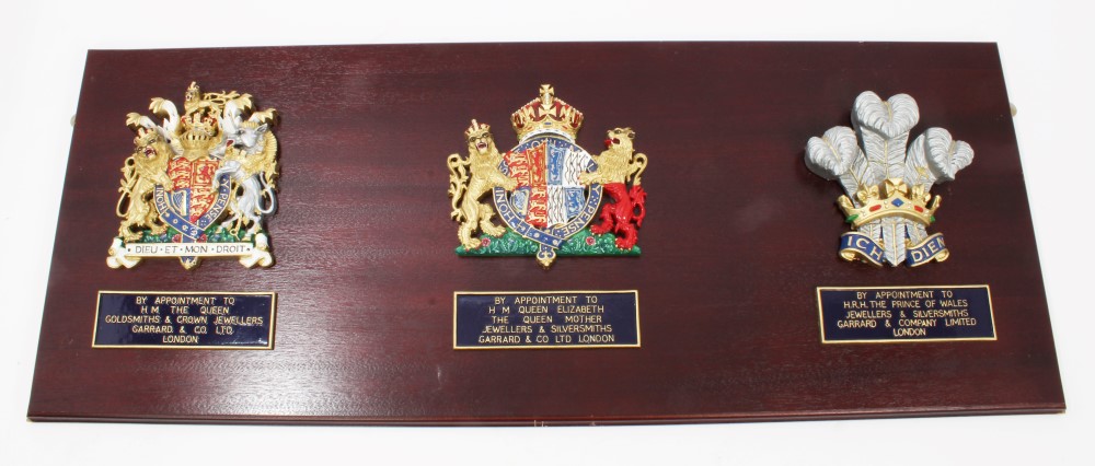 Set of three 1980s Royal Warrant Crests for Garrard & Co - The Crown Jewellers - comprising HM