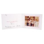 TRH The Prince and Princess of Wales - signed Christmas card with twin gilt embossed Royal ciphers