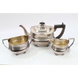 George V silver three piece tea set - comprising teapot of compressed baluster form,