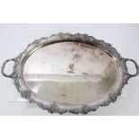 Early 19th century silver plated two-handled tray of oval form, with dished centre,