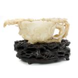 Fine quality 19th century Chinese carved and pierced jade lotus-form libation cup,