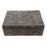 Early 20th century Japanese box decorated with applied metal plaques depicting human masks, animals,