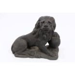 Early 19th century cast iron lion doorstop with ball under front paw,