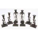 Two pairs Regency bronze candlesticks with stag and doe mounts and naturalistic branch supports,