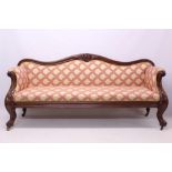 Mid-Victorian mahogany sofa with undulating carved show-wood frame and fine damask upholstery,