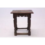 17th century oak joint stool with moulded top on shaped frieze and turned gun barrel supports and