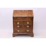 Early 18th century walnut featherbanded bureau of small proportions,