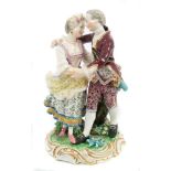 19th century Minton group of a young couple dancing arm in arm, decorated in coloured enamels,