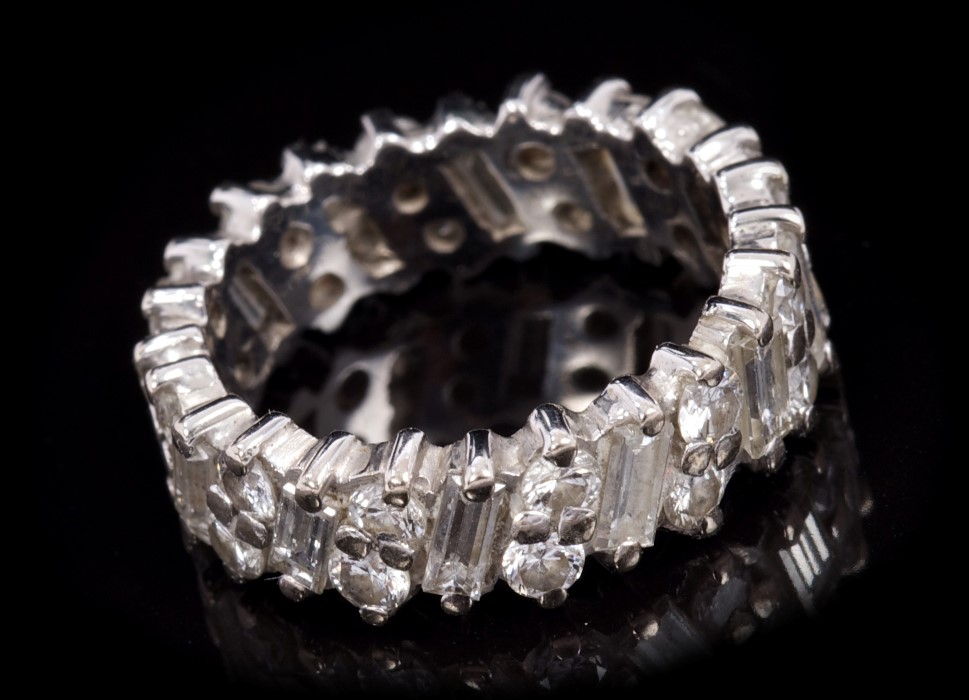 Diamond full band eternity ring with baguette cut diamonds alternating with duos of brilliant cut