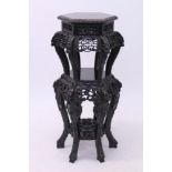 Fine late 19th / early 20th century carved Chinese hardwood two tier urn stand of hexagonal form,