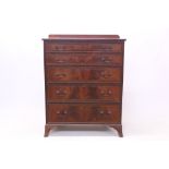 Edwardian mahogany and tulipwood crossbanded chest of drawers, having five long graduated drawers,