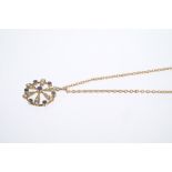 Edwardian sapphire and seed pearl snowflake pendant on trace chain with barrel clasp