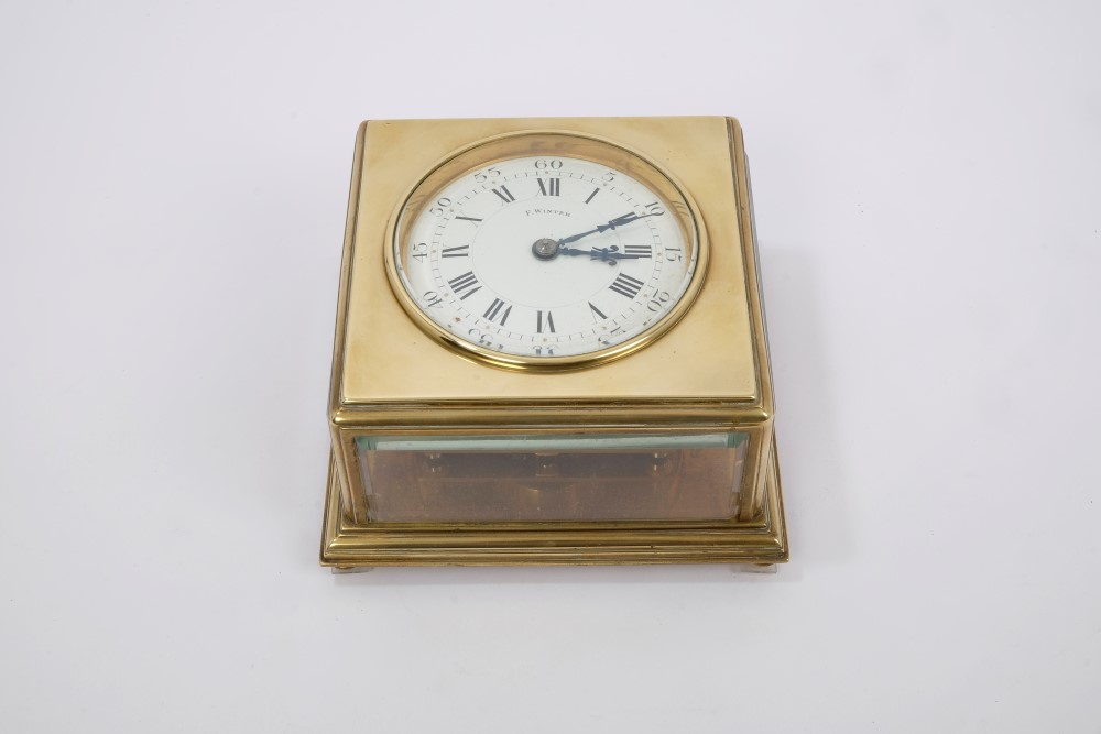 Unusual late 19th century table clock with square brass case, horizontal white enamel dial,