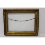 A late 19th century gilt and gesso frame - internal size 47cm x 67cm