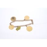 Edwardian yellow metal charm bracelet with sovereign, half sovereign and three other charms,