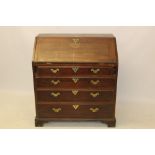George II mahogany bureau with sloping fall enclosing fitted interior of short drawers,