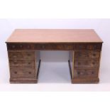 Regency walnut partners desk with later inset leather top and nine drawers about each kneehole,