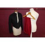 1930s officers' evening dress uniform with black cloth and red facings, black bullet buttons,