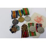 First / Second World War trio - comprising War and Victory medals (naming partly erased) and Second