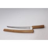 17th century Japanese wakizashi with koshirae - the unsigned curved blade with waved hamon with