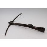 A late 18th century English stonebow with steel bow retained by a pair of shaped steel plates