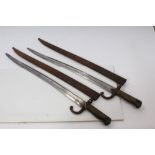 Two French 1866 pattern Chassepot bayonets with scabbards