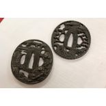 17th / 18th century Japanese iron tsuba with fine dragon decoration, signed, 6.