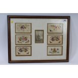 Six First World War silk sweetheart postcards mounted in glazed frame,