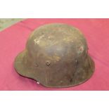 First World War Imperial German M16 helmet in rusty condition - with remains of lining and straps,