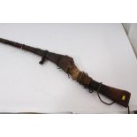 19th century jazel matchlock musket with flared fluted barrel and brass mounted wooden stock,