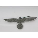 Nazi eagle and swastika cap badge with pin backing and post-War East German army belt with buckle