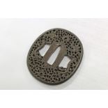 Fine 17th / 18th century Japanese iron tsuba with finely reticulated dragon and pearl decoration,