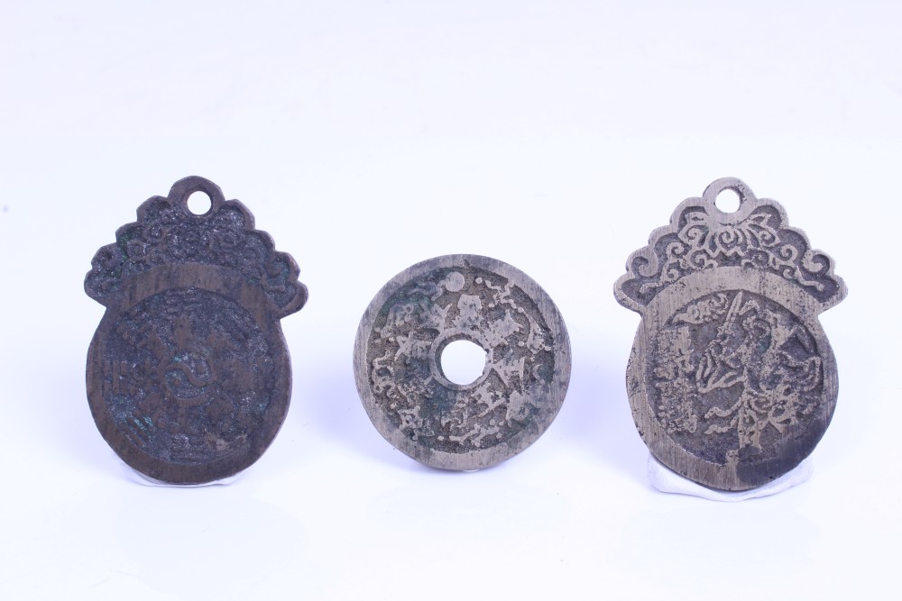 China - 19th century brass charms - to include one with the obverse Hsing-Kuan sword in hand and