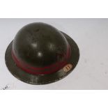 Second World War National Fire Service (N.F.S.) green painted tin helmet with Unit no.